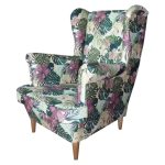 Piękny fotel Uszak boho monstera na drewnianych nóżkach.