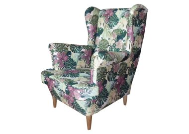 Piękny fotel Uszak boho monstera na drewnianych nóżkach.